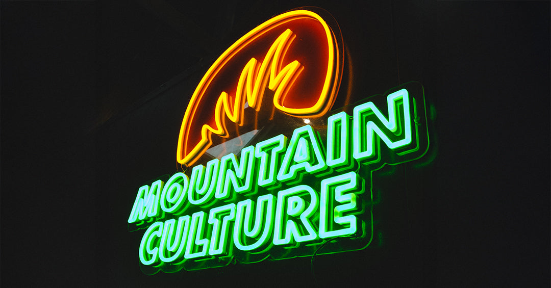 Mountain Culture — green and orange neon logo